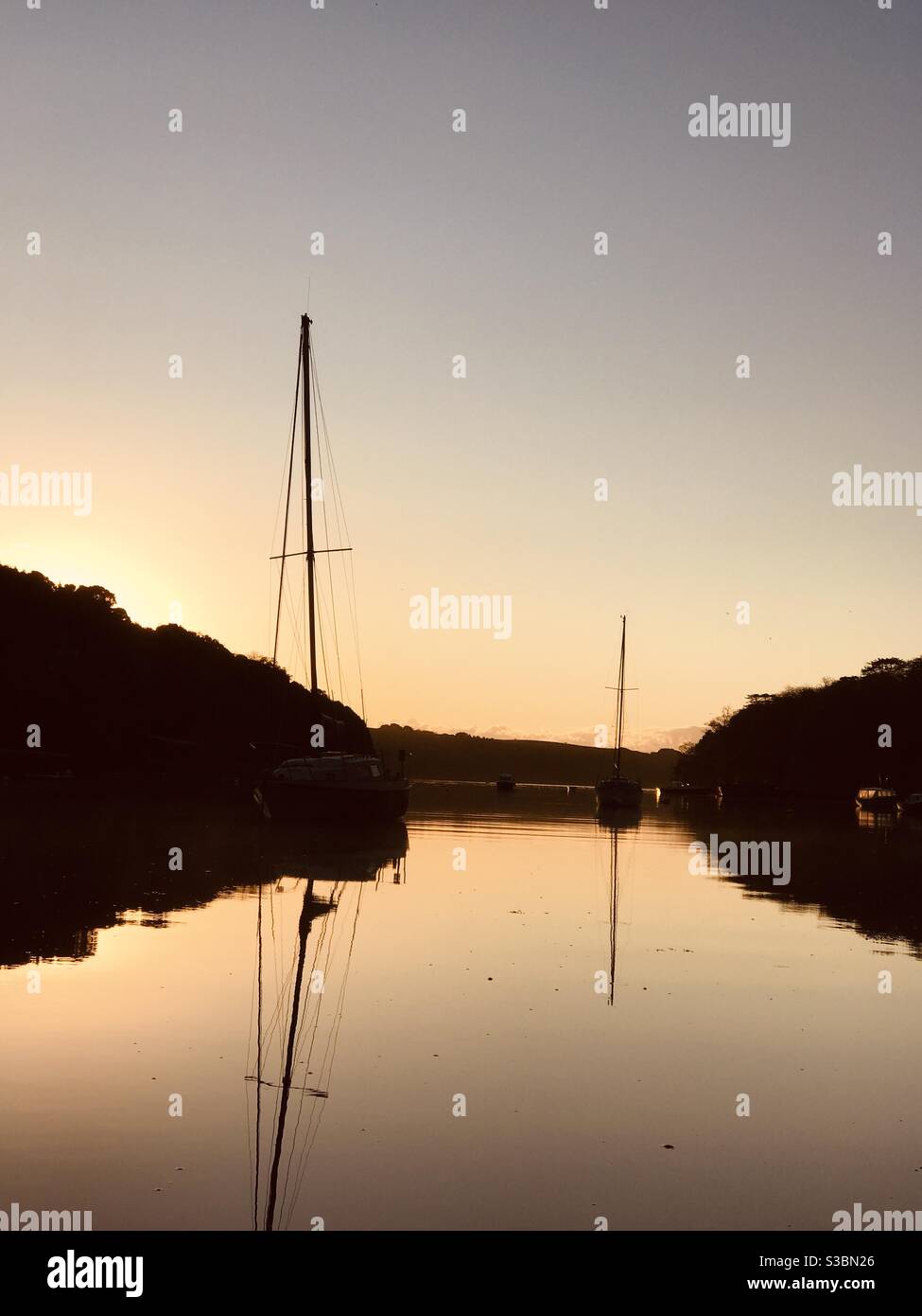 silhouetted yachts in Pill Creek December morn - Smartphone Captured Stock Image