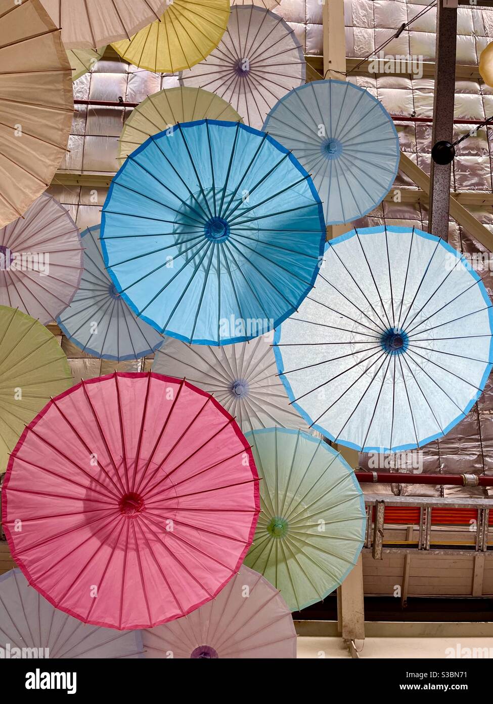 Vietnamese paper umbrellas hanging from ceiling in a market in Perth