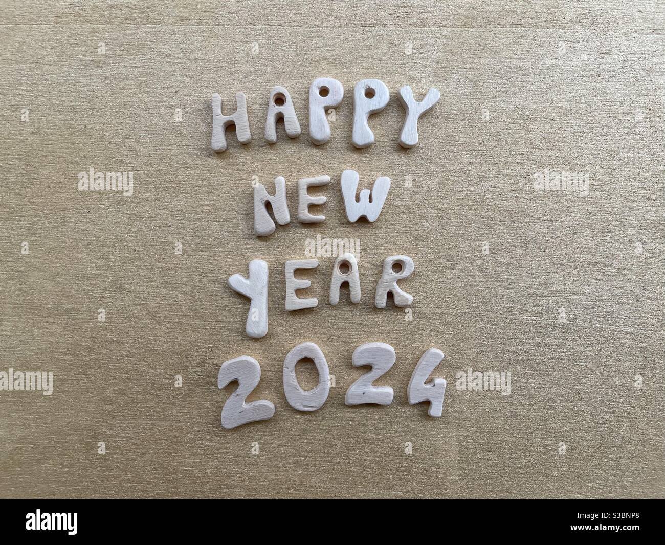 Happy New Year 2024 with wooden letters and numbers Stock Photo
