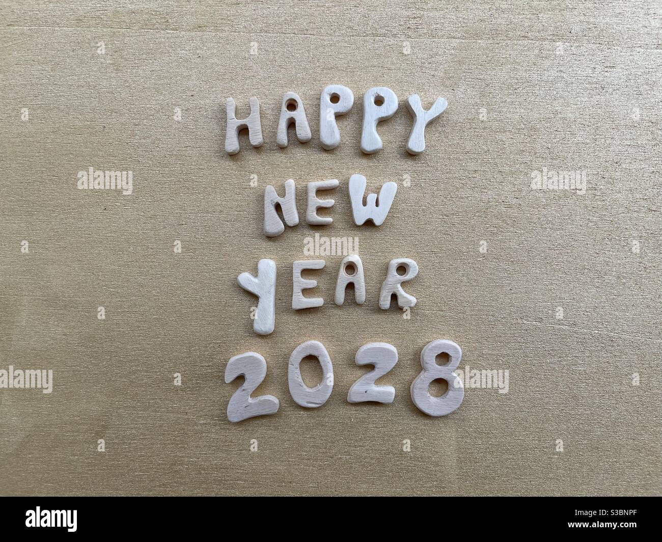 Happy New Year 2028 with wooden letters and numbers Stock Photo