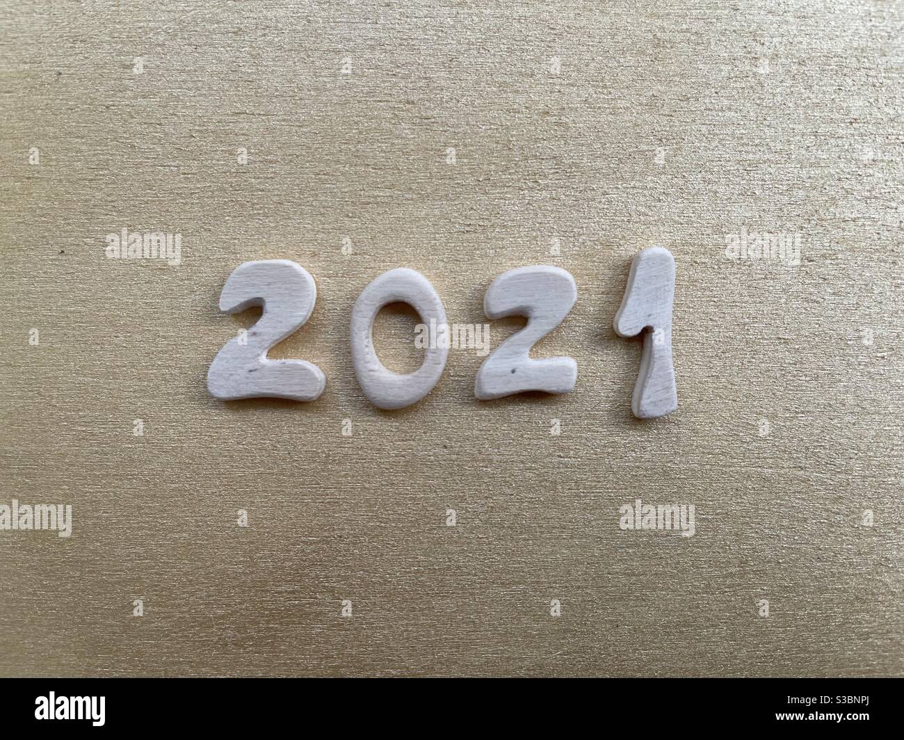 2021 year composed with handmade wooden letters - Smartphone Captured Stock Image