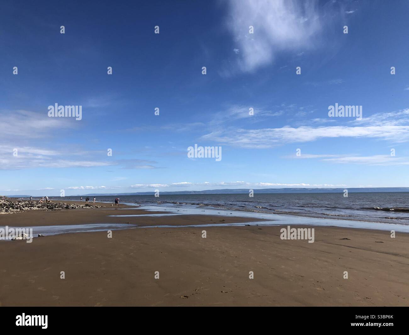 Welsh Beach with blue skies Stock Photo