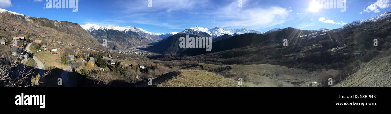 Panoramic view from Jarrier over Saint-Jean-de-Maurienne and the Aiguilles d’Arves in winter. French Alps Stock Photo