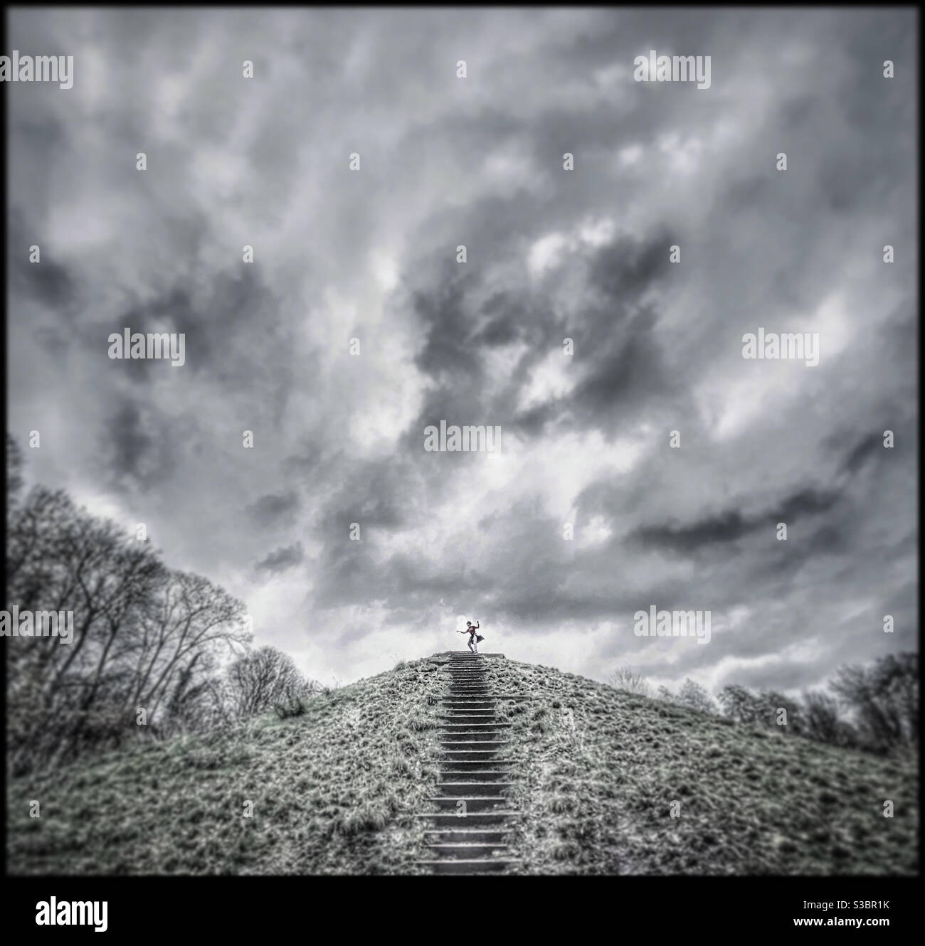 A child dances on a hill top - Smartphone Captured Stock Image