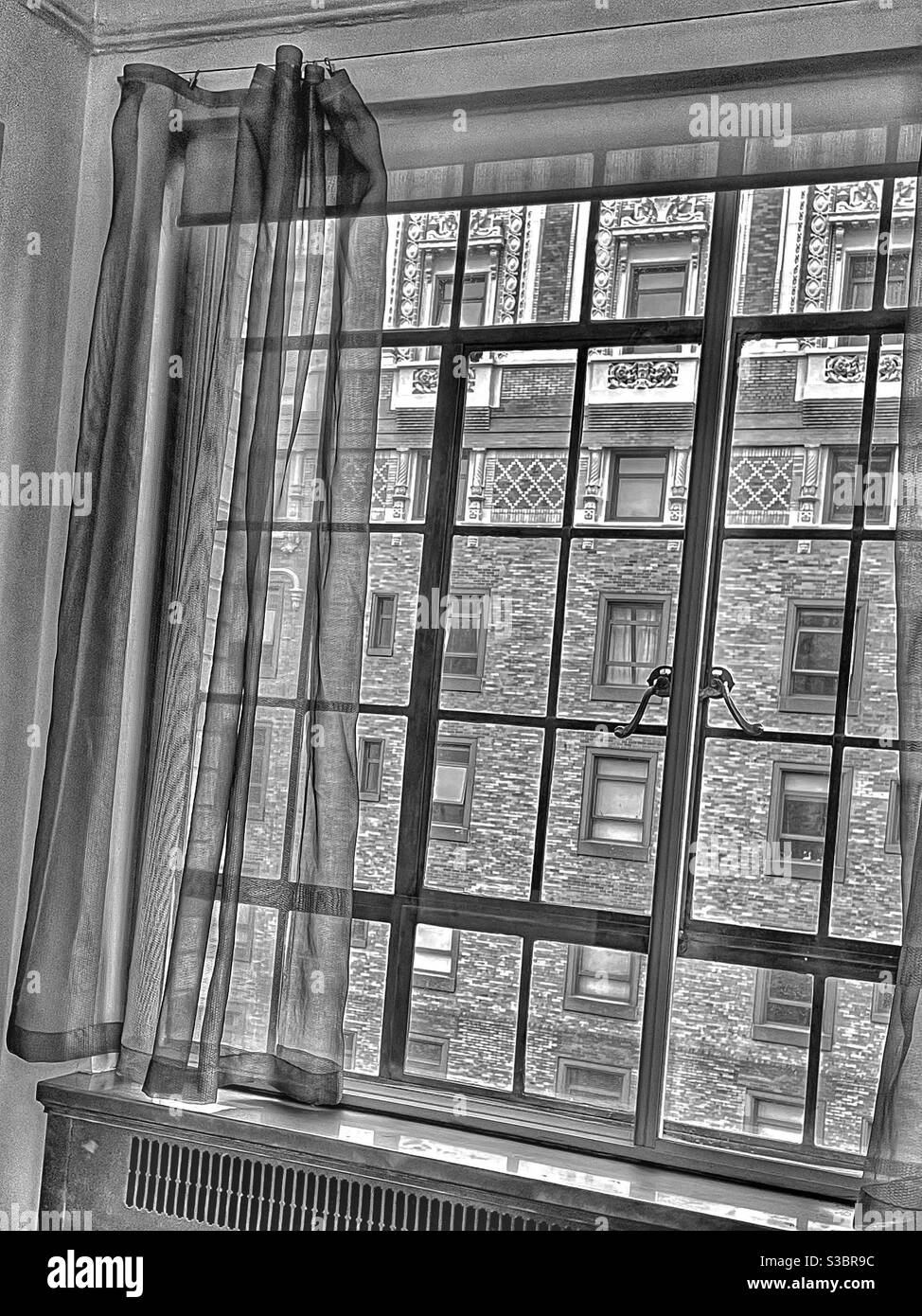 Nostalgic photo with vintage appeal from a window curtain on Park Avenue facing the former Hotel Vanderbilt at 4 Park Avenue, Manhattan, NYC, USA - Smartphone Captured Stock Image