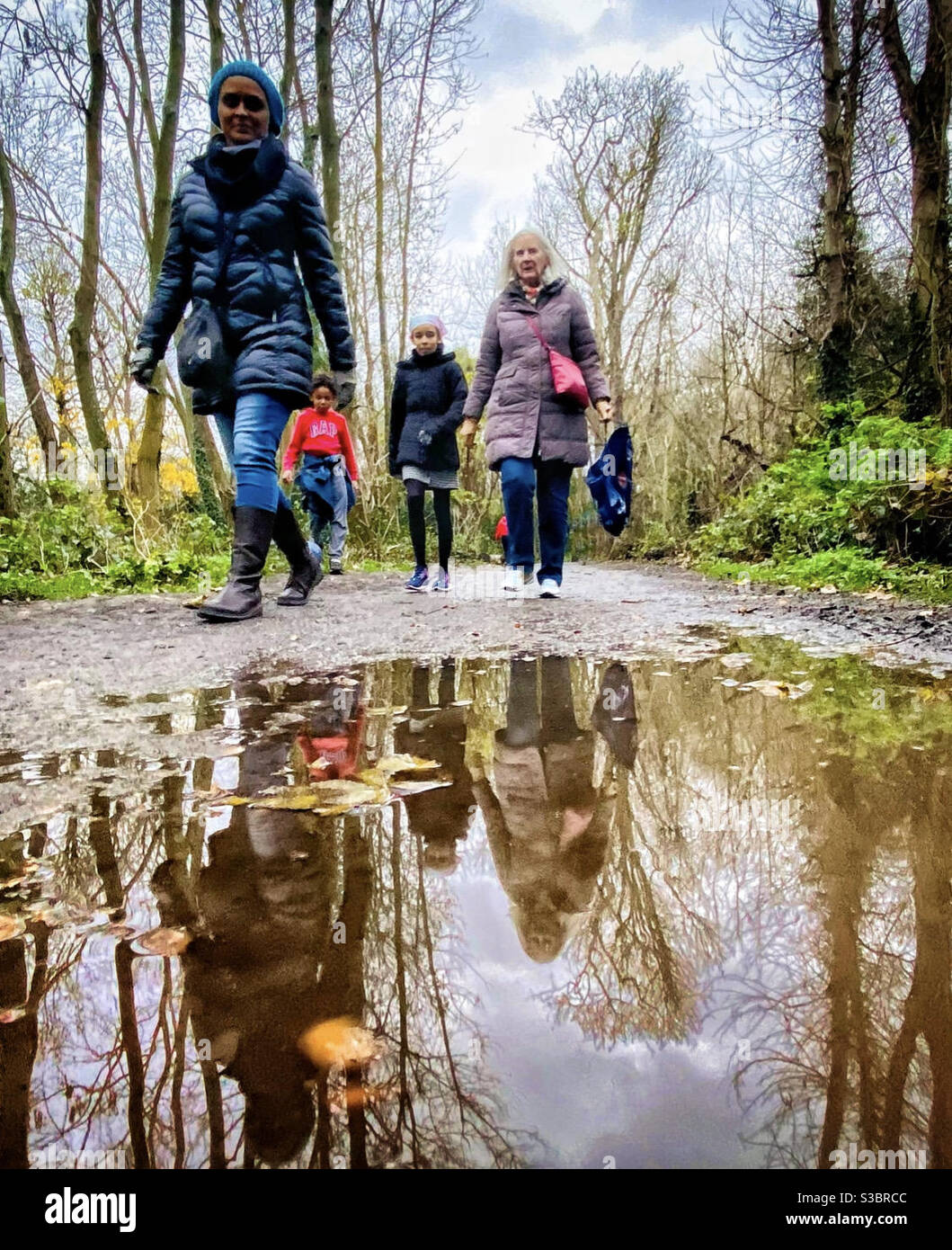 A family strolling through the countryside. - Smartphone Captured Stock Image