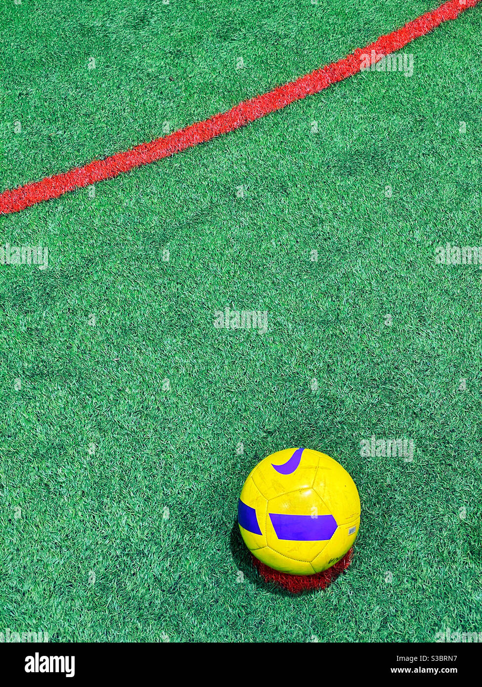 A football/soccer ball sits on the penalty spot awaiting a potential goal scoring kick! Photo credit -©️ COLIN HOSKINS. - Smartphone Captured Stock Image