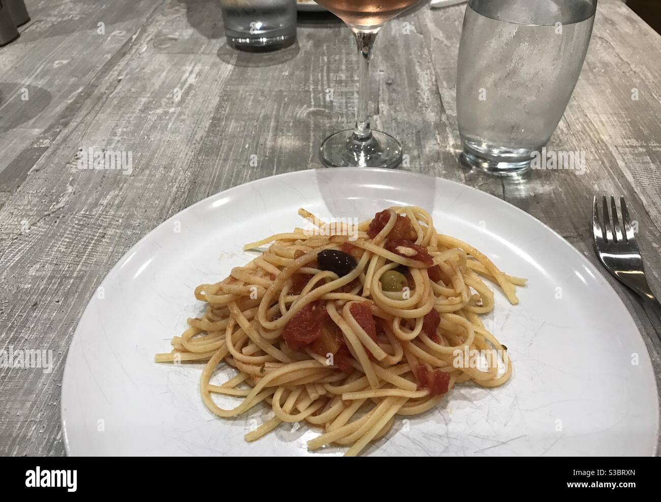 Linguine pasta with a spicy mackerel, tomato and olive sauce - Smartphone Captured Stock Image