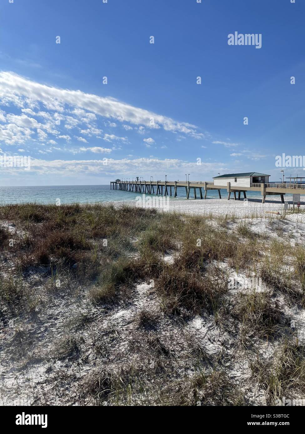 Upper view of the Okaloosa public fishing pier on an autumn day Emerald Coast Florida - Smartphone Captured Stock Image