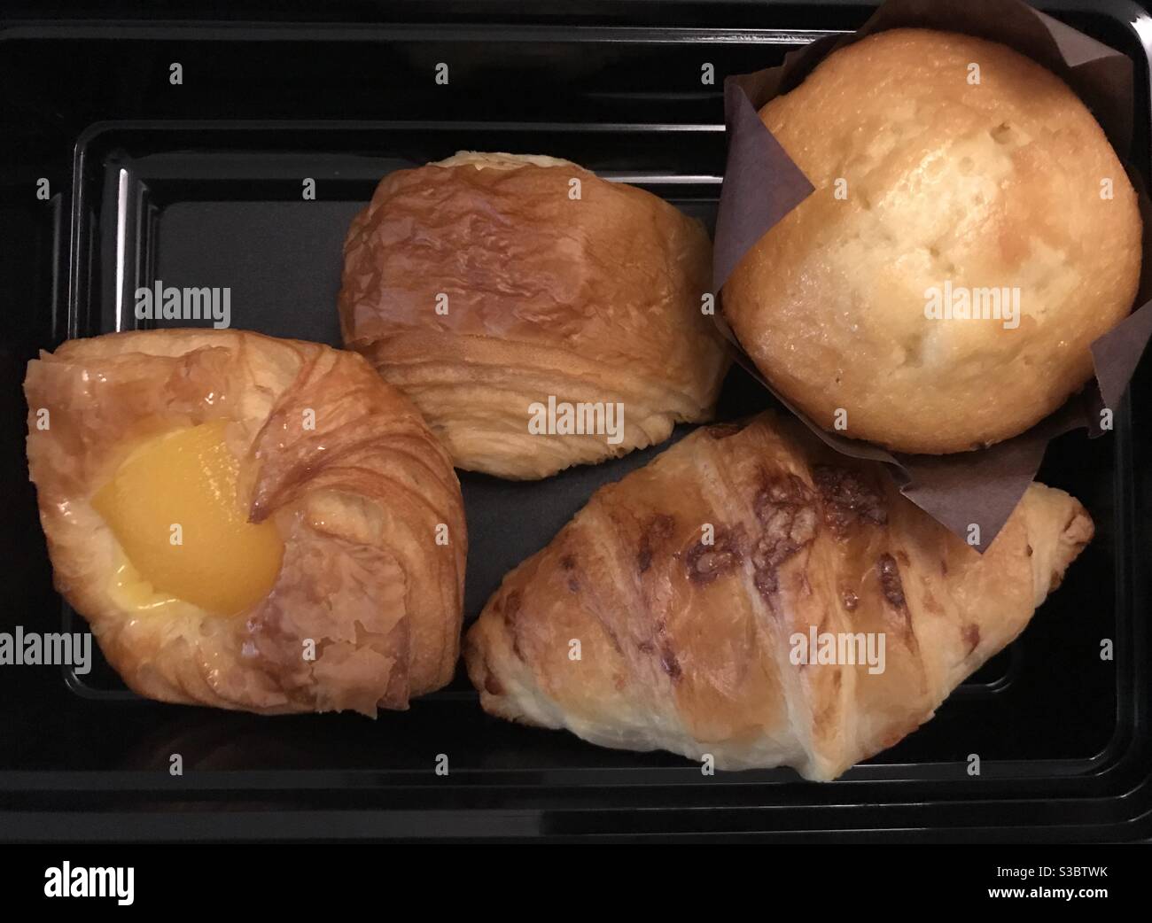 A selection of freshly baked pastries on a tray - Smartphone Captured Stock Image