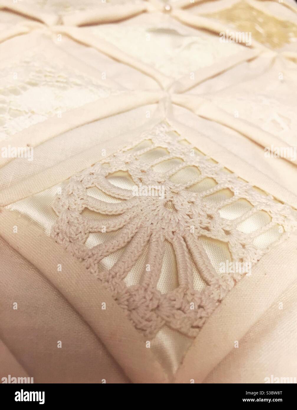 Handmade Cathedral window pattern quilt, close-up - Smartphone Captured Stock Image