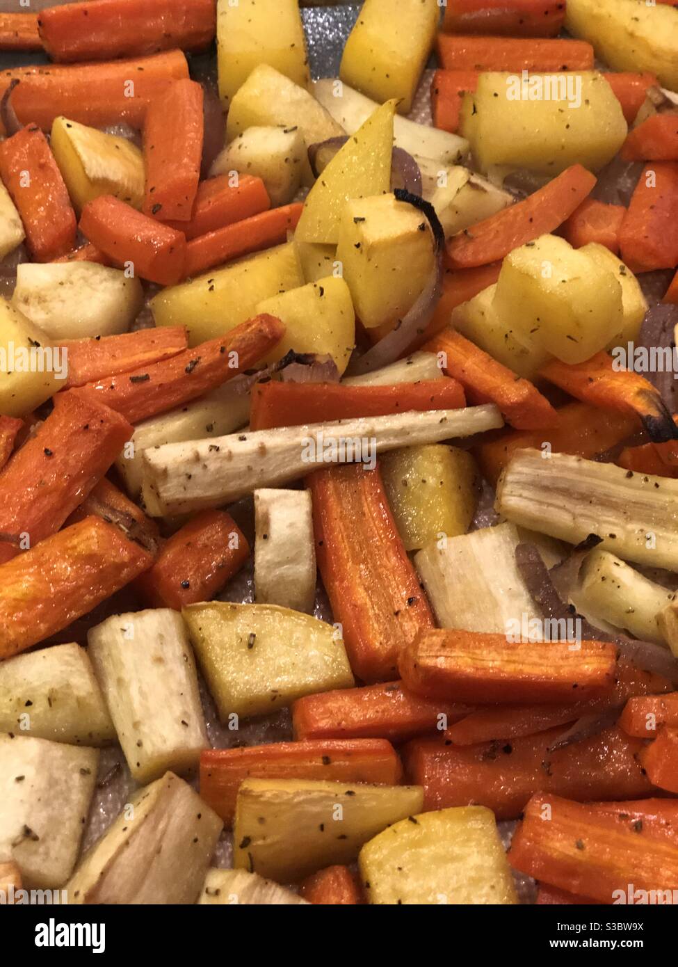 Tray of baked root vegetables Stock Photo Alamy