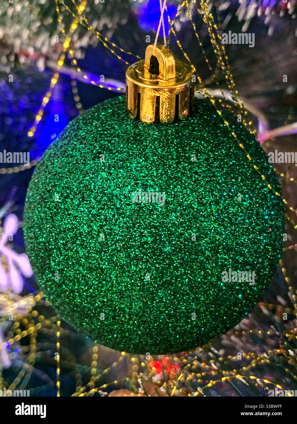 Christmas decoration ball of green color close up - Smartphone Captured Stock Image