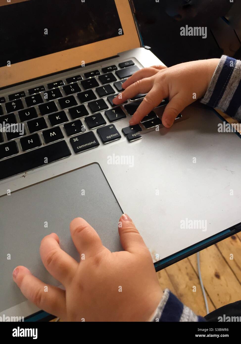 Toddler with laptop - Smartphone Captured Stock Image