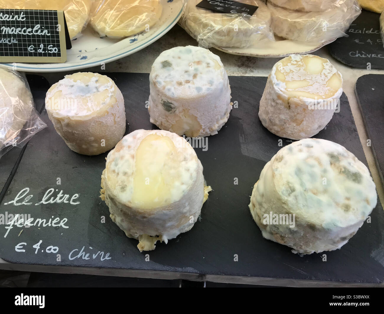Plate with goat cheese in food market in France - Smartphone Captured Stock Image