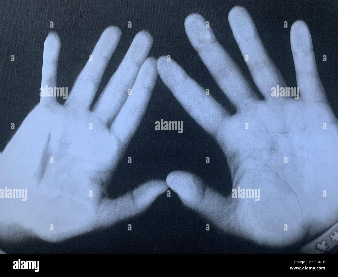 Hands photocopy - fingers spread and palms showing Stock Photo