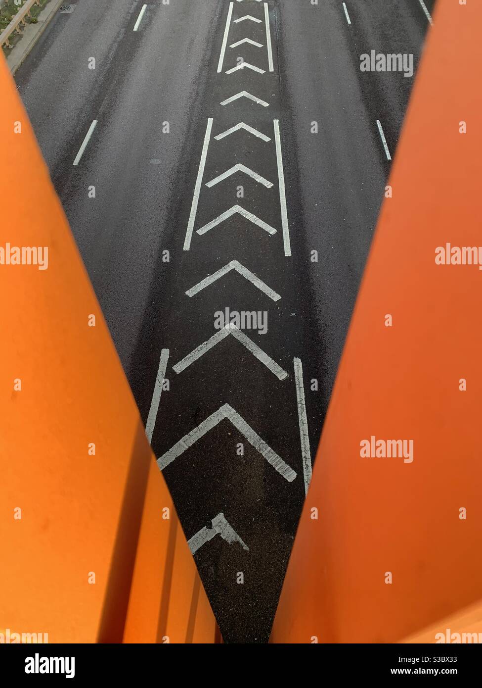 Motorway chevrons seen from orange bridge - Smartphone Captured Stock Image