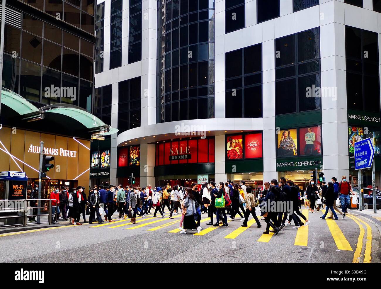 Pedestrians crossing Pedder street in Hong Kong's Central district. - Smartphone Captured Stock Image