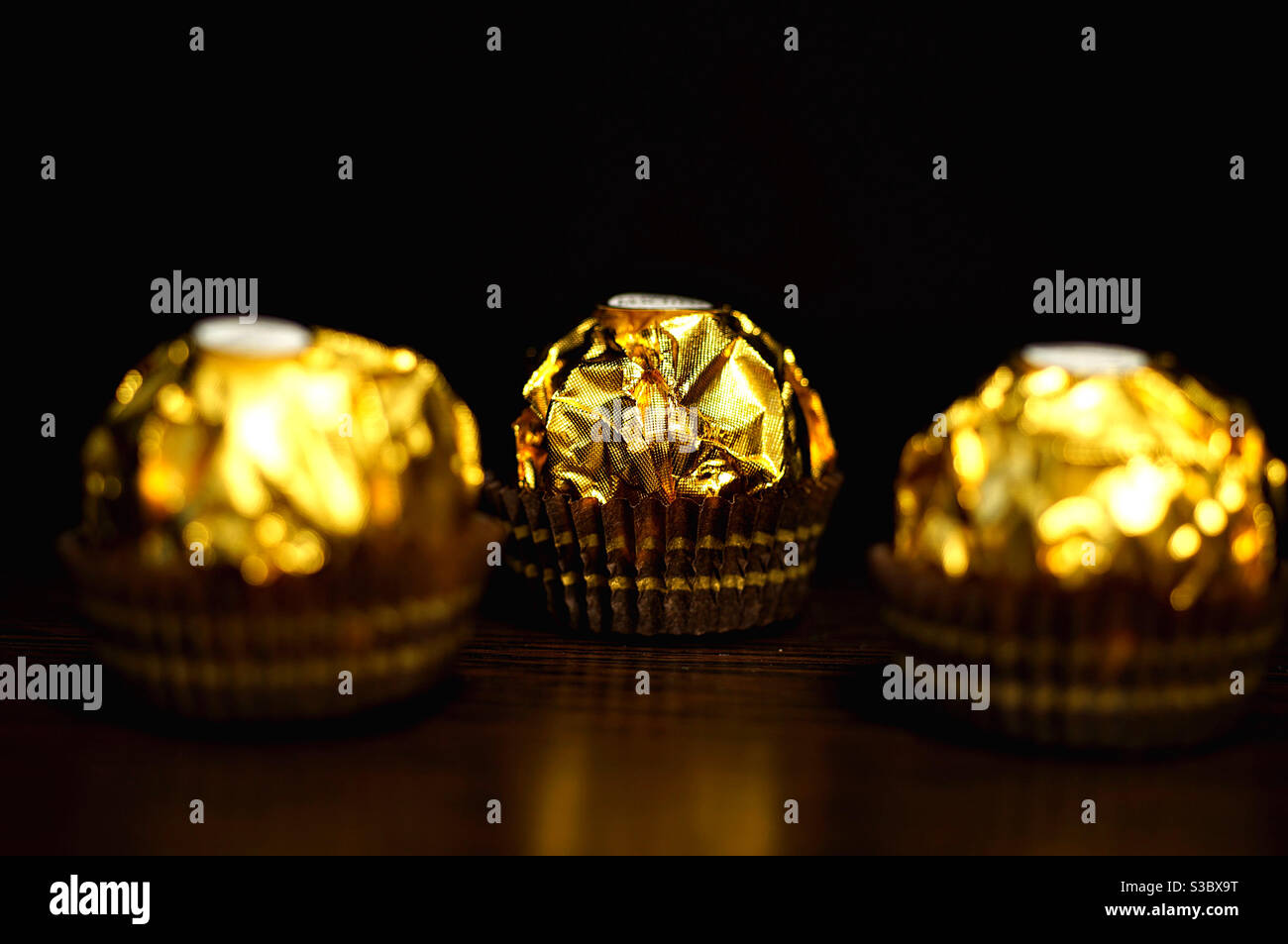 Beautiful golden candy design on dark background - Smartphone Captured Stock Image