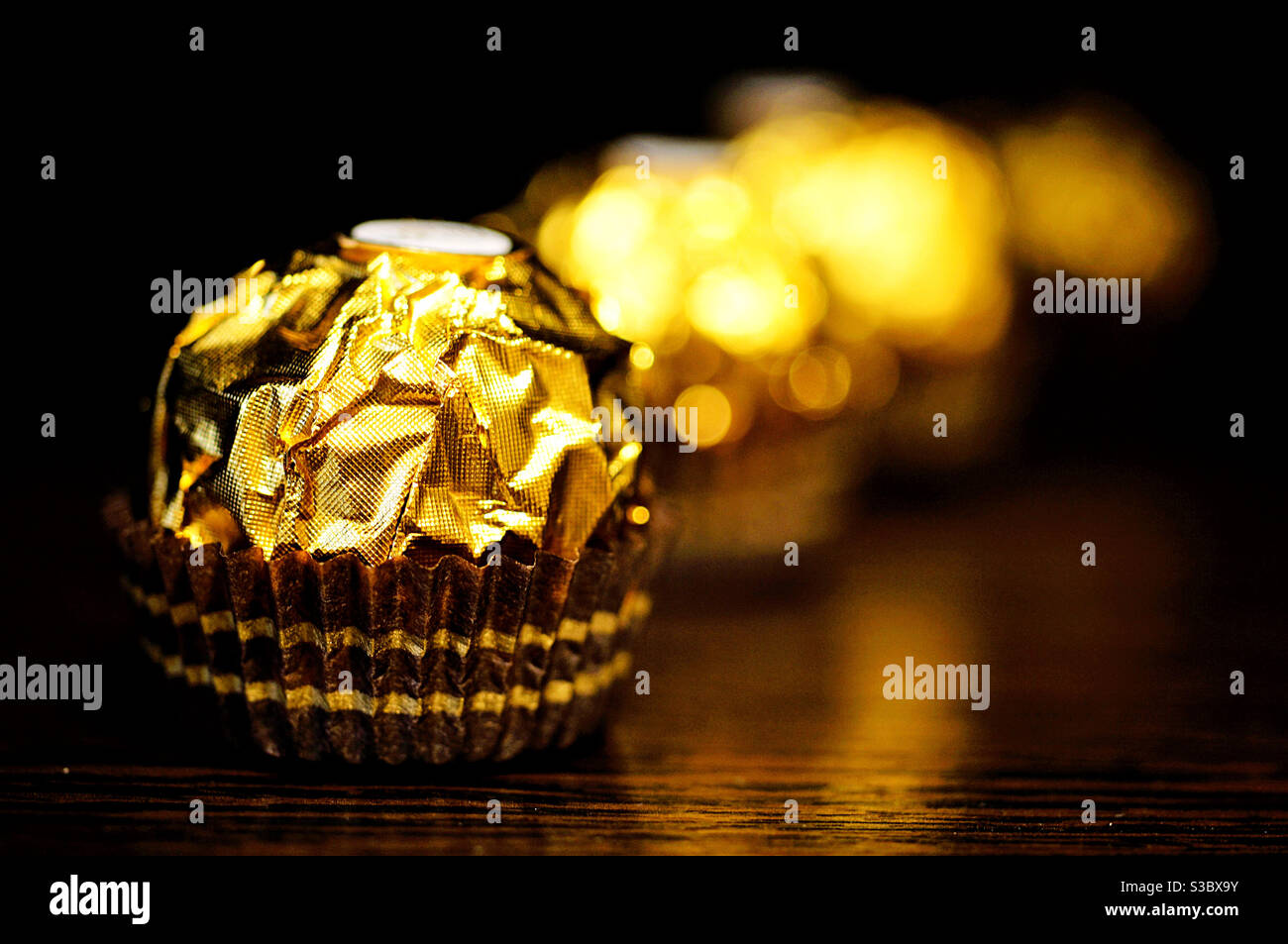 Row of Sweets in a beautiful gold design - Smartphone Captured Stock Image
