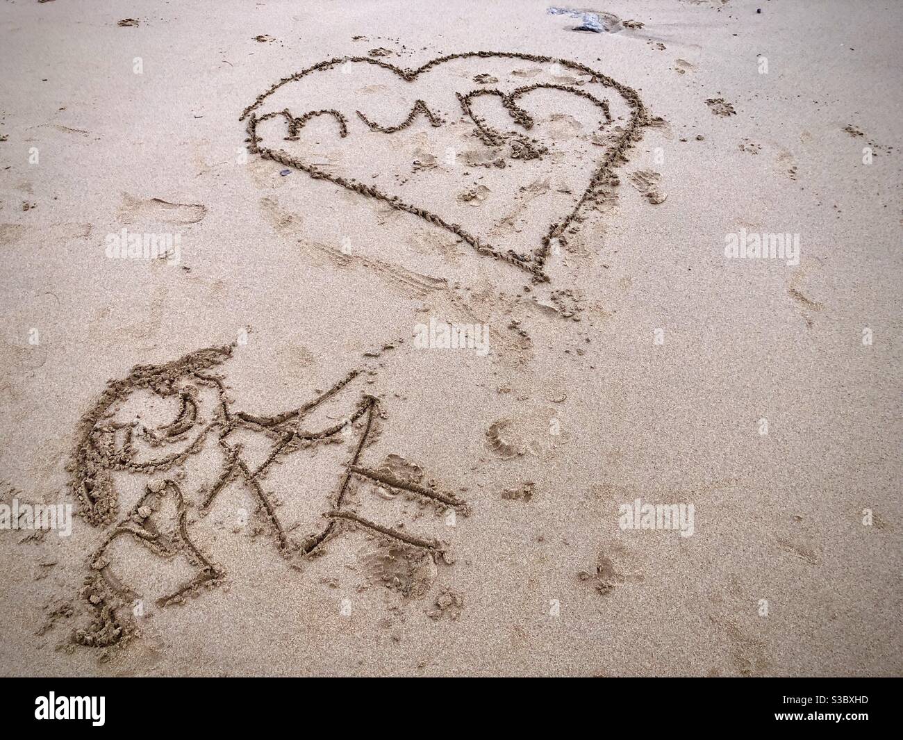 Heart with the word Mum drawing on the beach - Smartphone Captured Stock Image