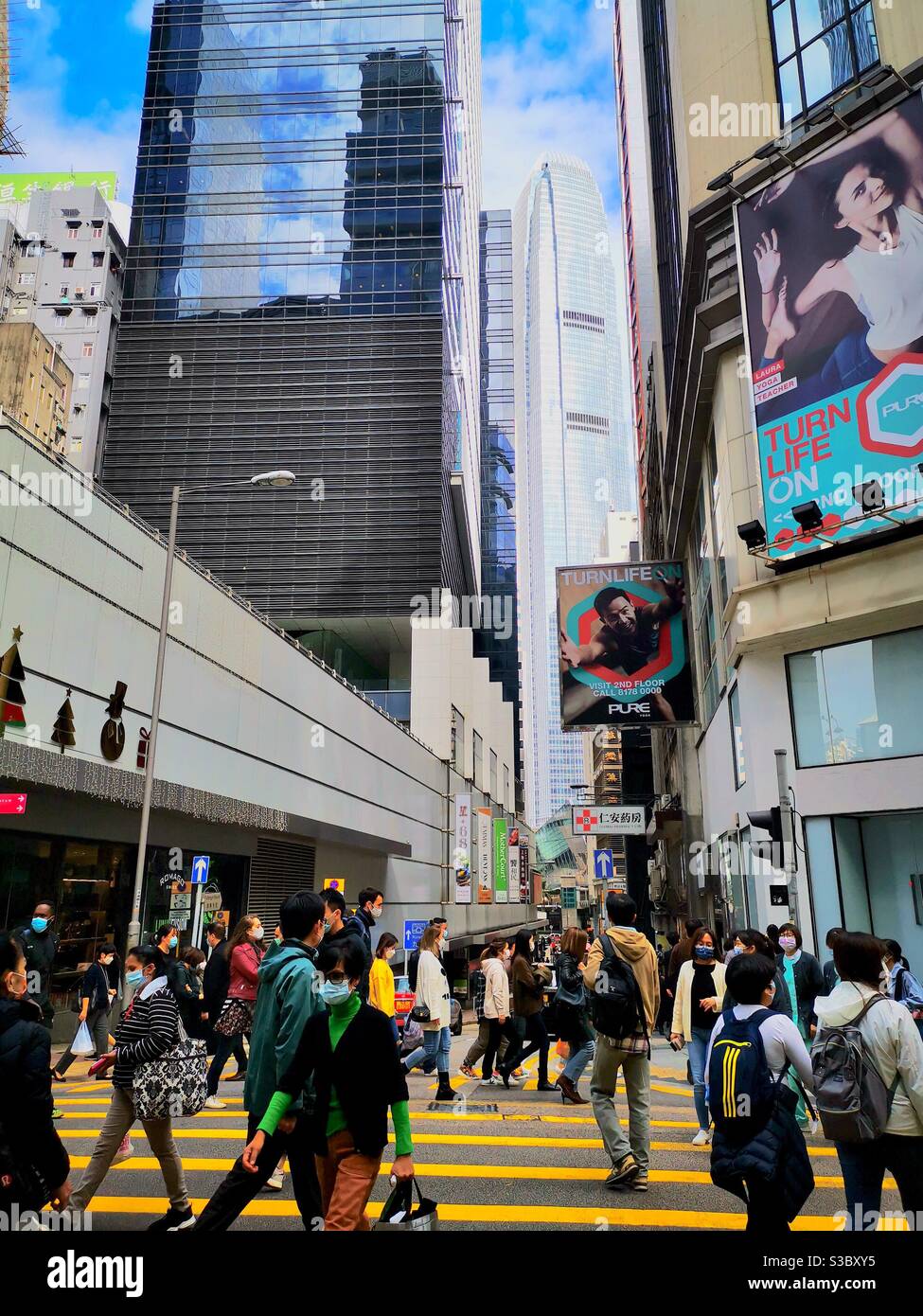 Pedestrians crossing Queens road central in Hong kong. - Smartphone Captured Stock Image