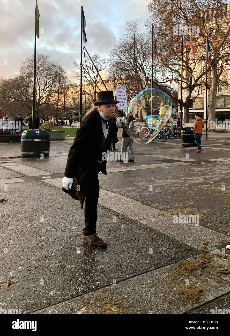 Man blowing bubbles within bubbles at Marble Arch London Stock Photo