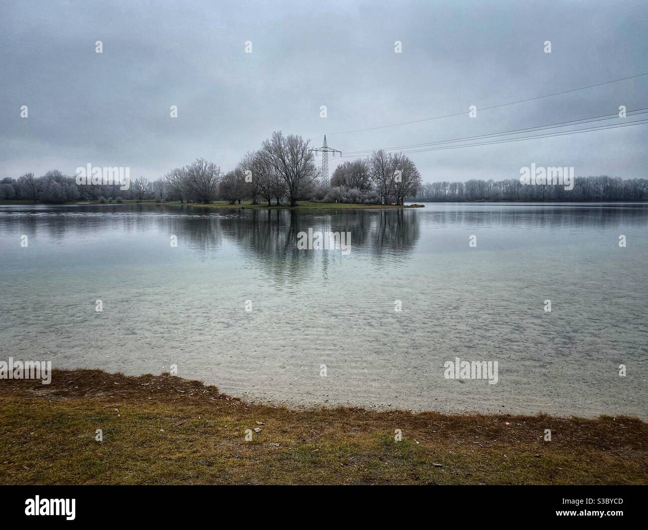 Lake Feringasee in Munich area on a dark winter day, Germany. - Smartphone Captured Stock Image
