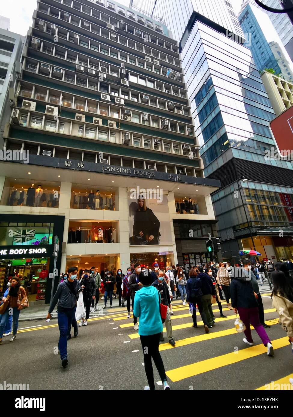 Pedestrians crossing Queens road central in Hong kong. - Smartphone Captured Stock Image