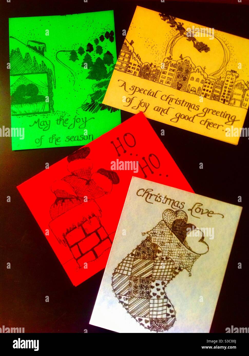 Assortment of Merry Christmas handmade holiday cards with pen & ink drawings & calligraphy by artist, Cheryl Acrey. - Smartphone Captured Stock Image