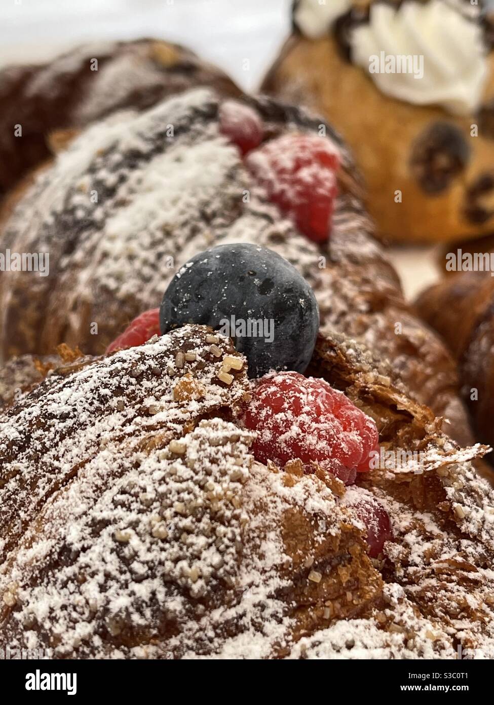 Closeup view over a croissant with soft fruits on top - Smartphone Captured Stock Image