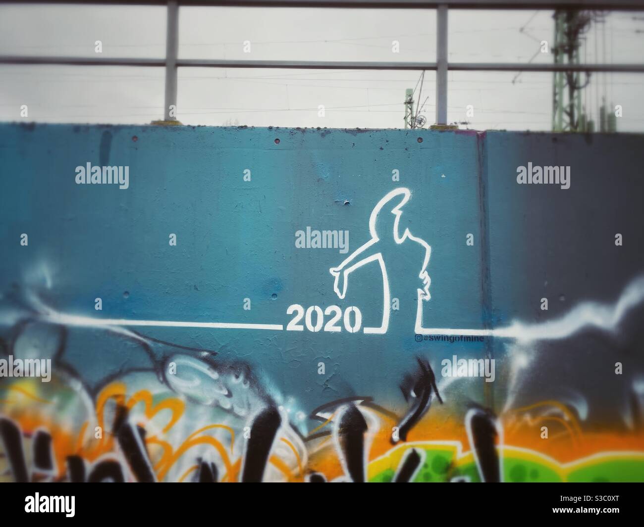 A Graffiti of the cartoon character la linea lamenting the year 2020, Berlin, Germany - Smartphone Captured Stock Image