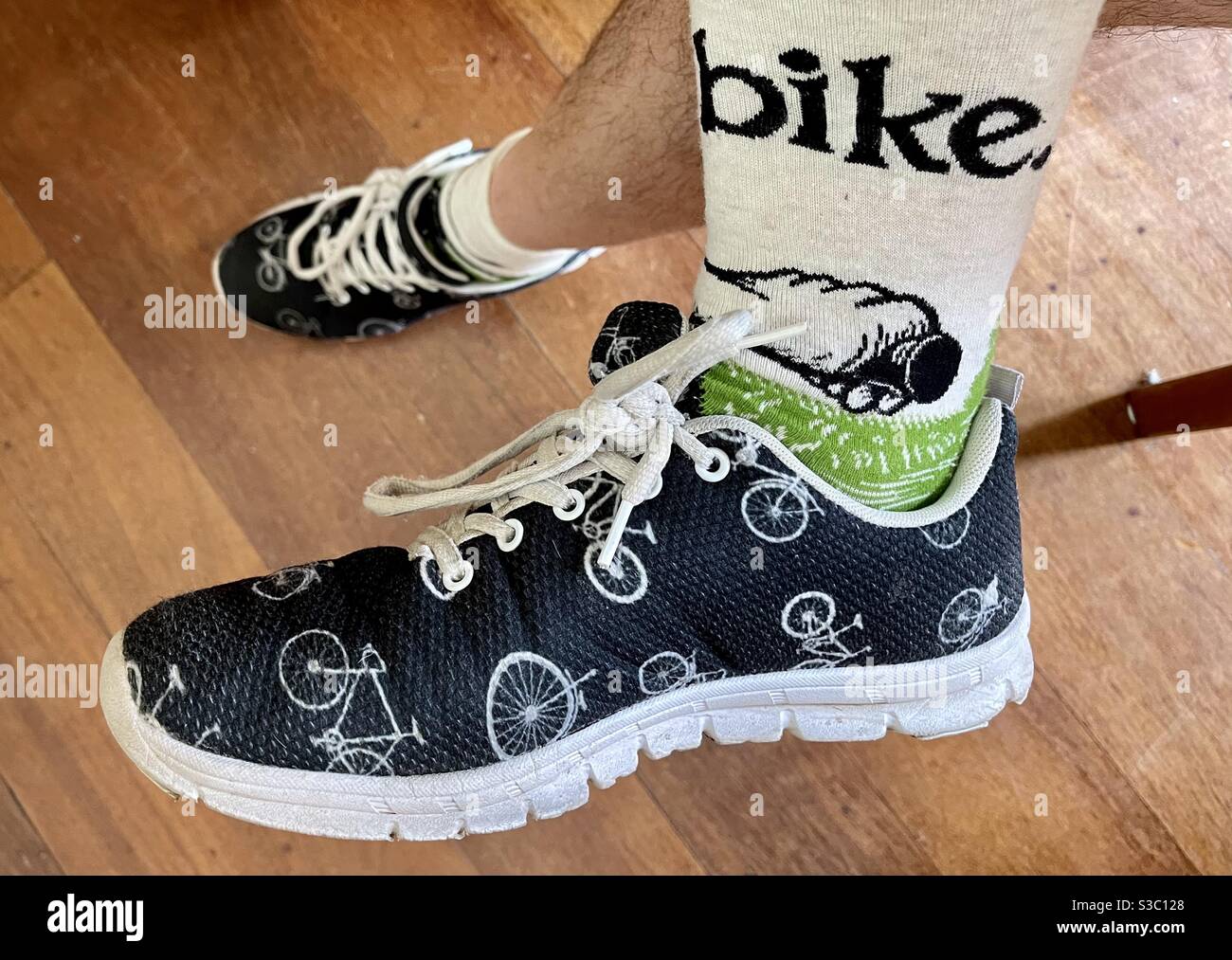 Cycling culture pair or shoes and socks with bike pattern Stock Photo
