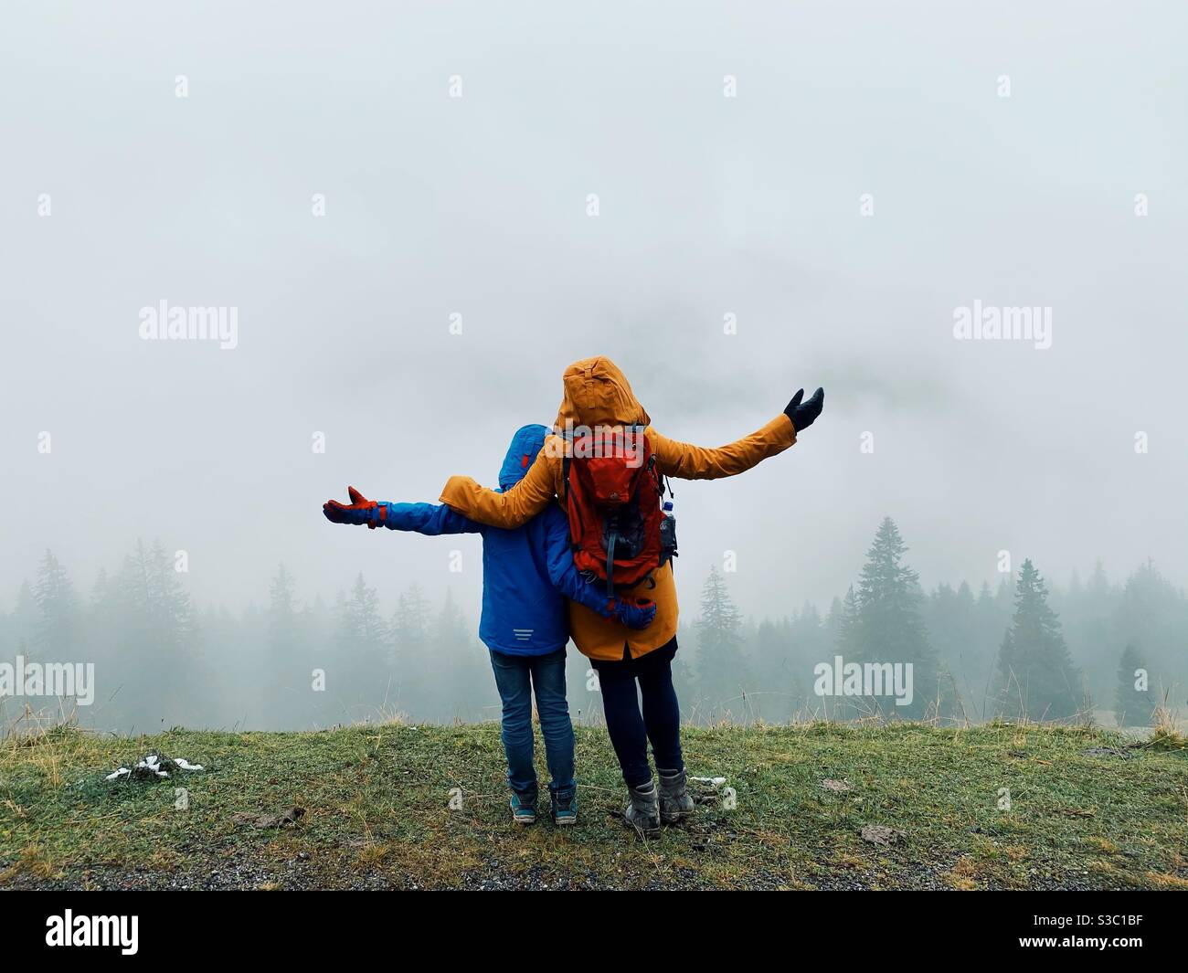 A mother and her son Hiking in the German Alps, Bolsterlang, Bavaria, Germany - Smartphone Captured Stock Image