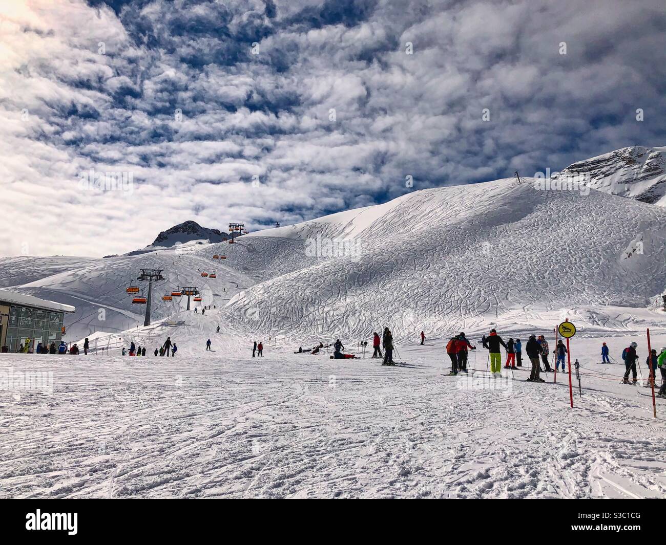 Skiing lift queue on the top of Zugspitze, the highest German mountain. - Smartphone Captured Stock Image