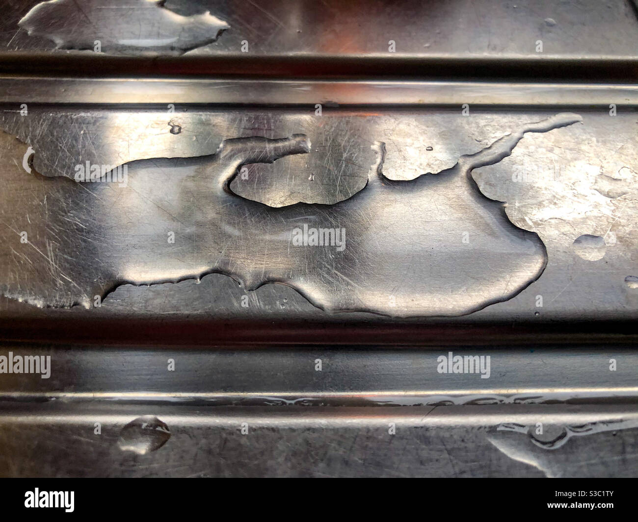 Water on a draining board in a kitchen. - Smartphone Captured Stock Image Water on a draining board in a kitchen. - Smartphone Captured Stock Image