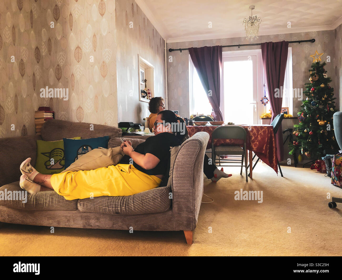 Relaxing in the lounge dining room after Christmas. - Smartphone Captured Stock Image
