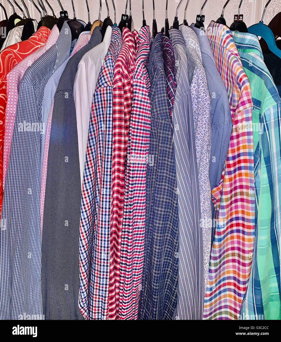 Wardrobe of work shirts. No longer worn due to lockdown a d remote working. Stock Photo