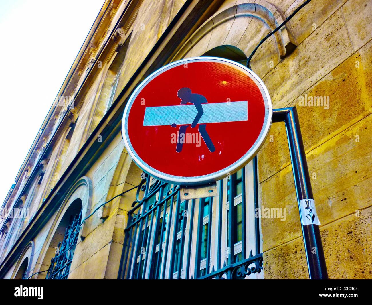 Street art road sign intervention Clet Abraham Stock Photo - Alamy