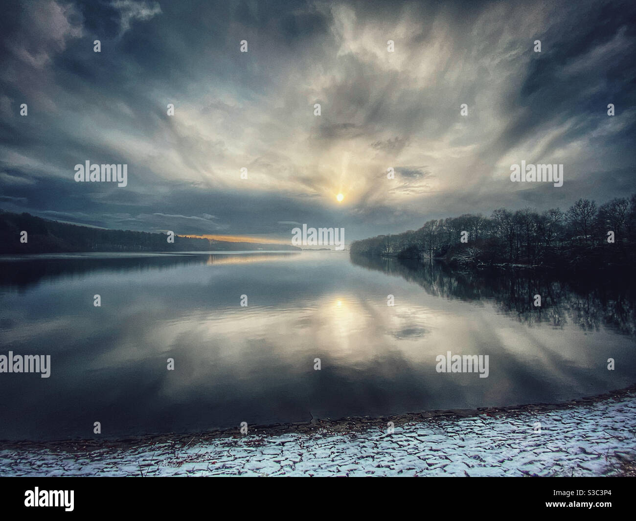 Rivington reservoir in Lancashire on a winter morning with light covering of snow Stock Photo