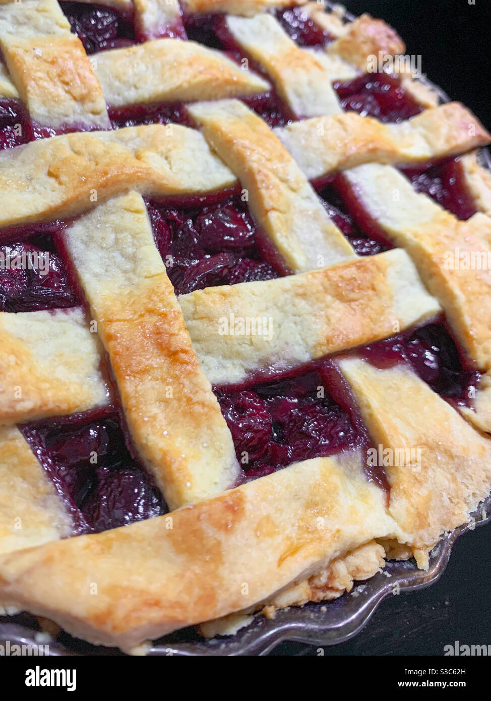 Homemade Cherry pie freshly baked and piping hot from the oven - Smartphone Captured Stock Image