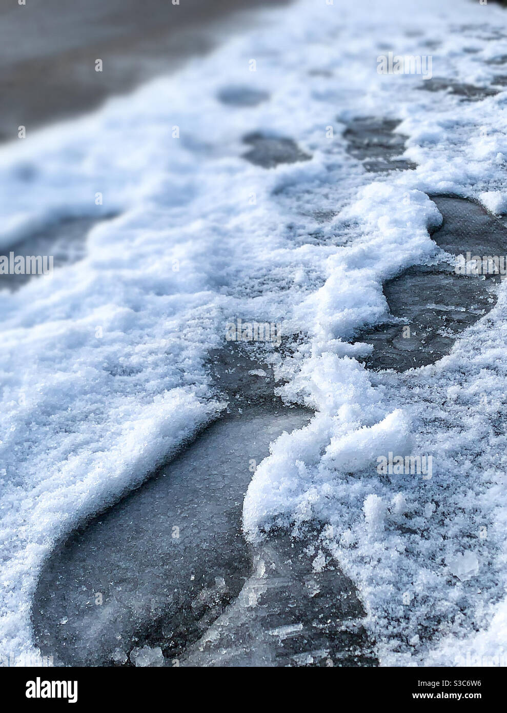 Footprints in the snow.  UK weather forecast.  Beast from east.  Snowy conditions.  Weather warnings. Stock Photo