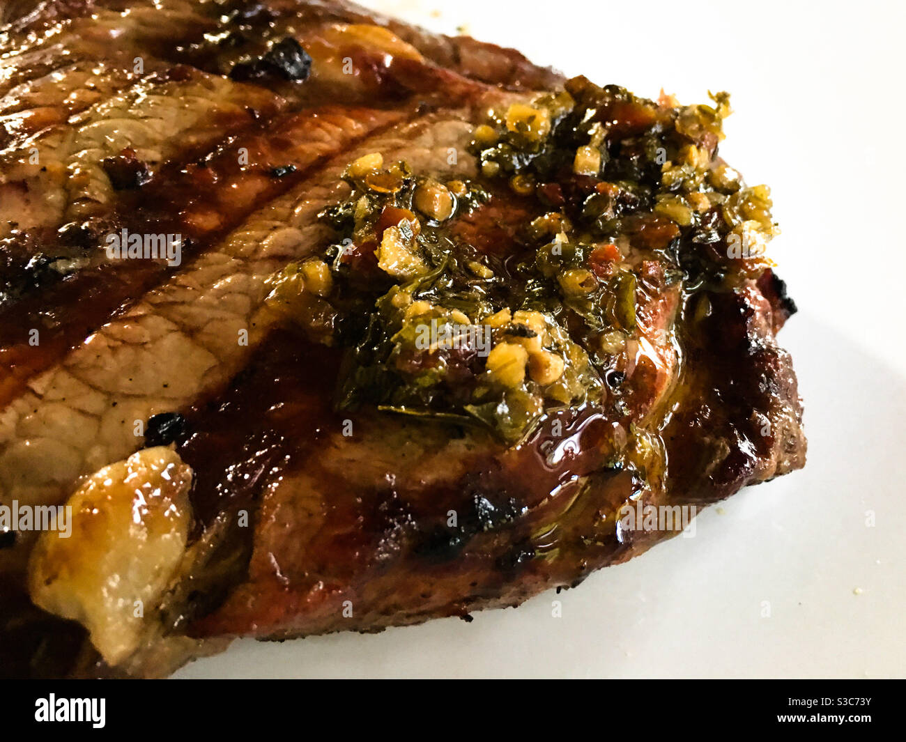 A steak with chimichuri sauce Stock Photo