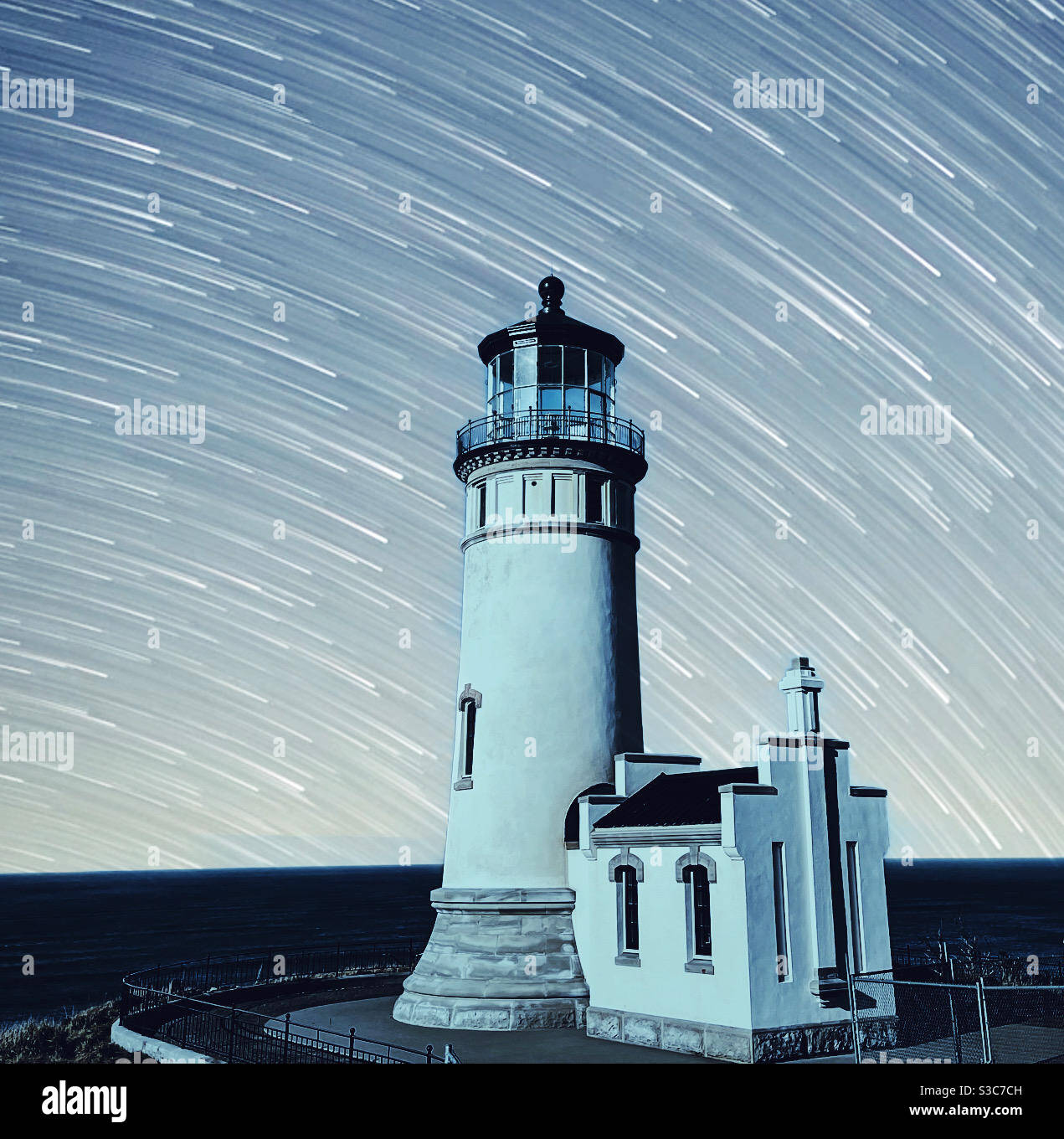 North Head lighthouse in Cape Disappointment State Park at night with star trails - Smartphone Captured Stock Image