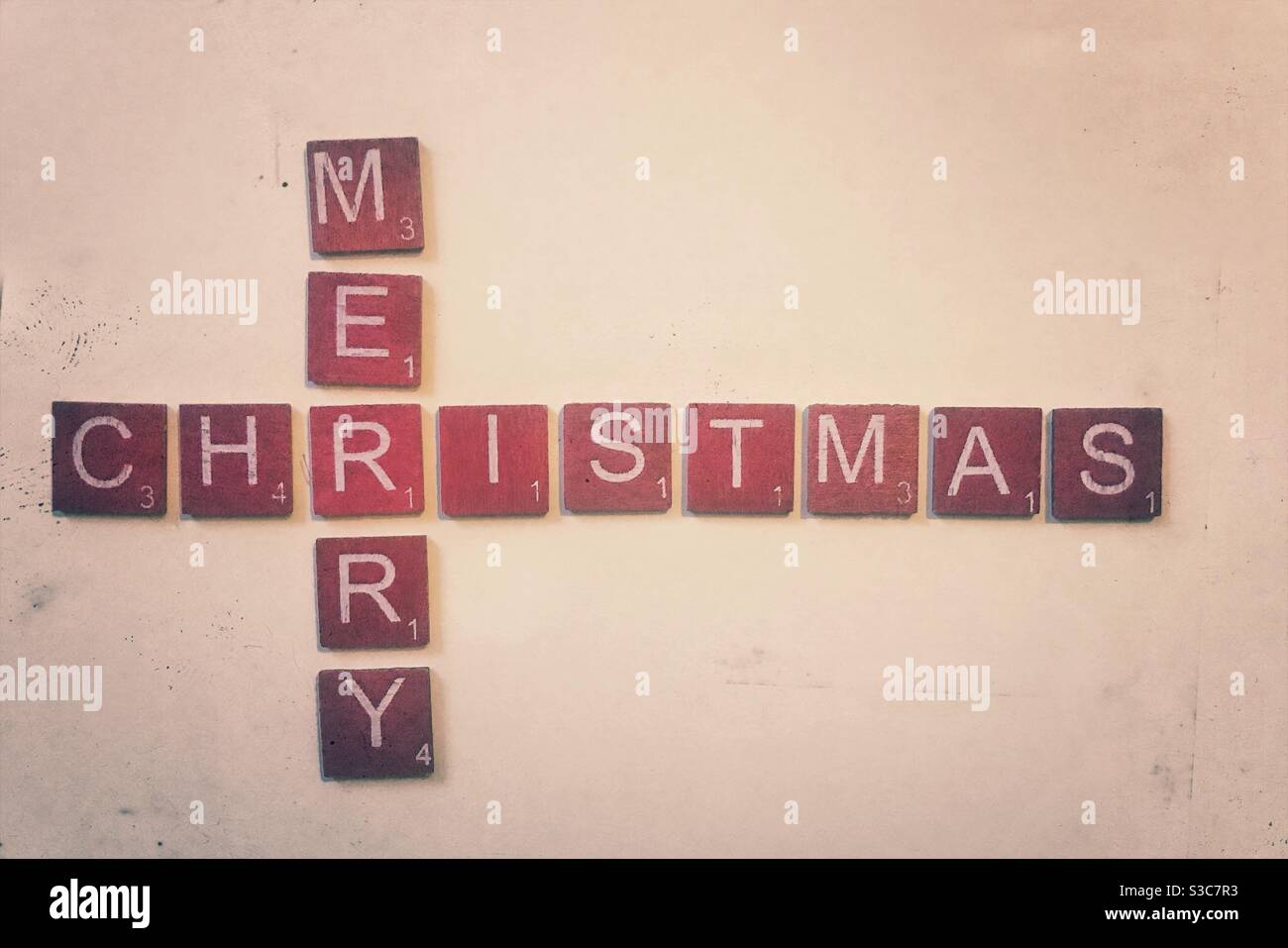 Red wooden tiles spelling out Merry Christmas. - Smartphone Captured Stock Image