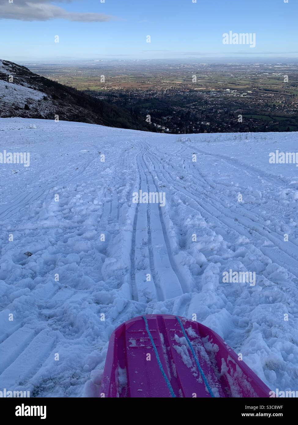 Sledging down the Malvern Hills Stock Photo Alamy