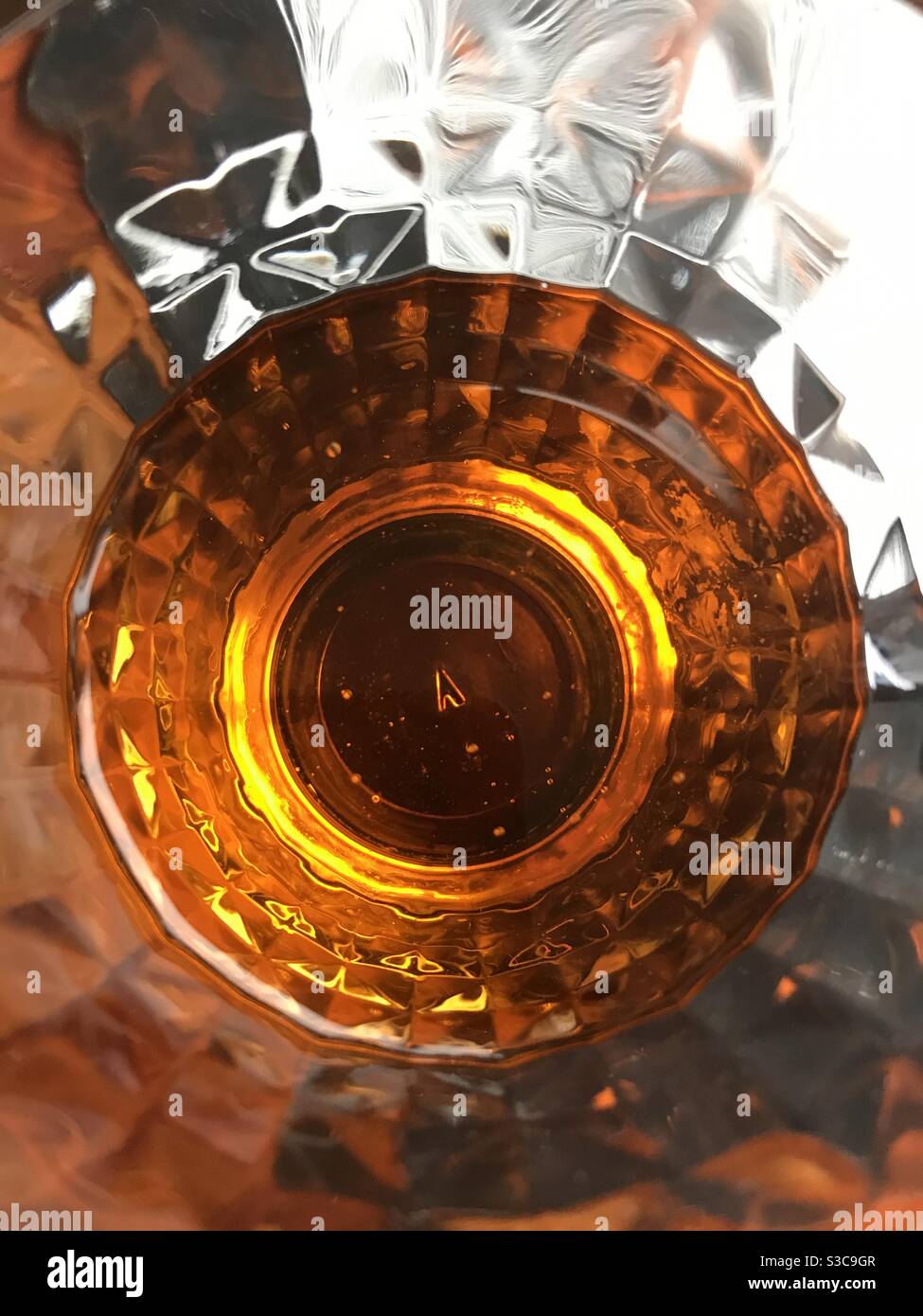 Pop of amber orange in a glass! Stock Photo