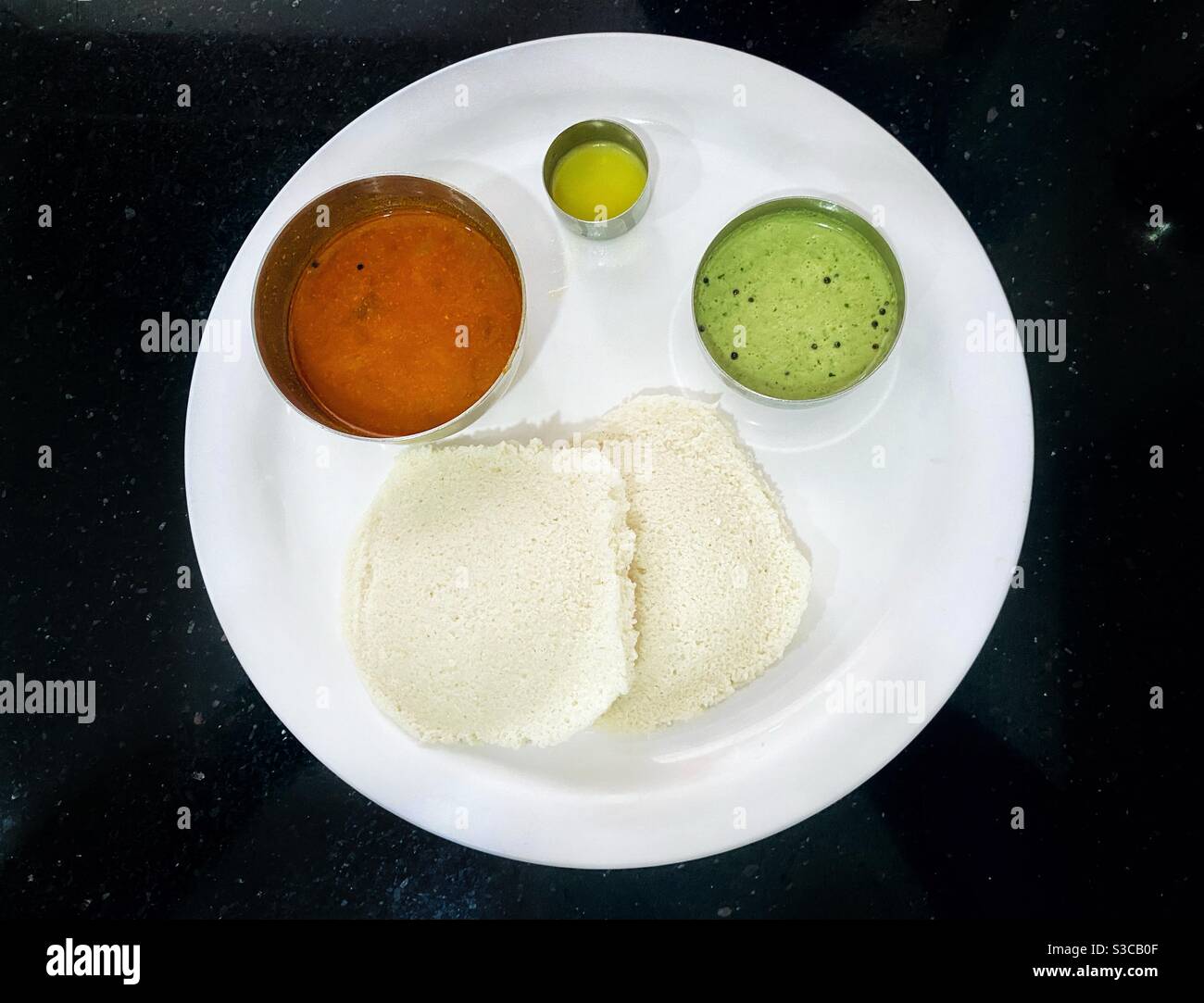 Idli sambhar and chutney- healthy and wholesome South Indian breakfast Stock Photo