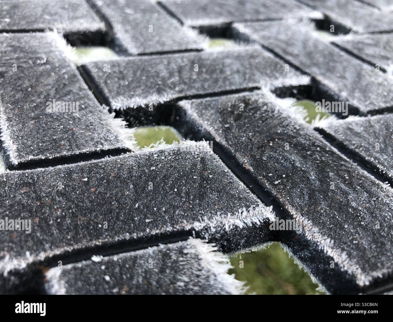 Abstract of frosted metal chair in a garden in winter, England, United Kingdom - Smartphone Captured Stock Image