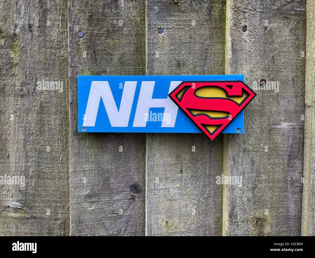 The real superheroes. NHS sign with superman symbol Stock Photo
